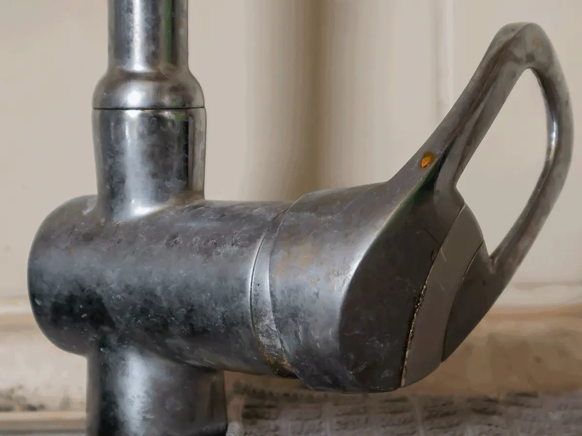 Hard water mineral buildup on a faucet in an Arizona home